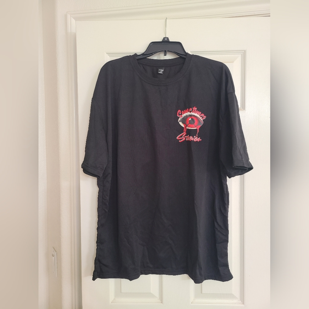 Black Short-Sleeve Graphic Tee with Red Eye Accent